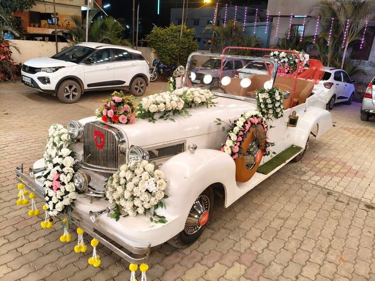 Luxury open-top vintage wedding convertible styled with bespoke fresh floral arrangements
